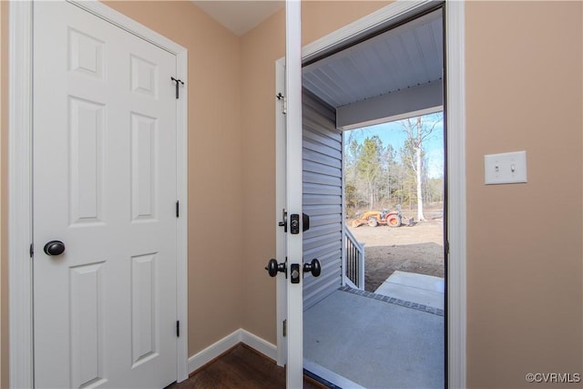 doorway to outside featuring dark hardwood / wood-style floors