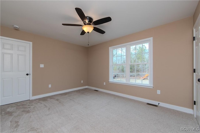 carpeted empty room with ceiling fan