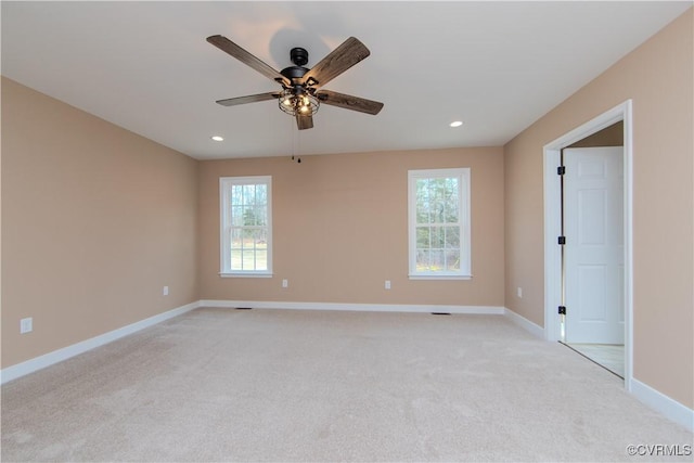 unfurnished room with light carpet and ceiling fan