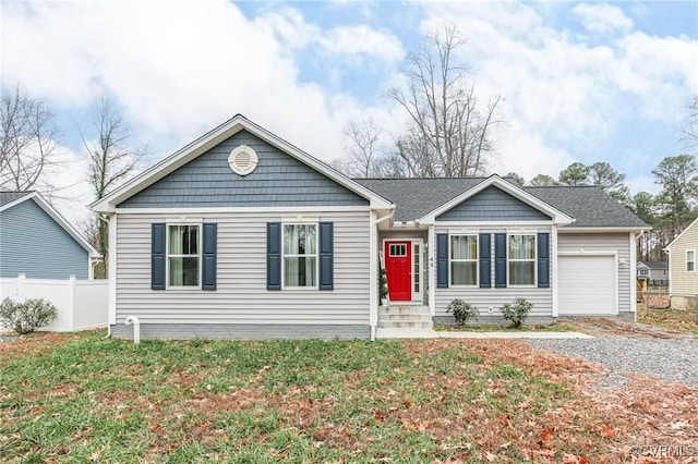 view of front of house with a garage and a front lawn