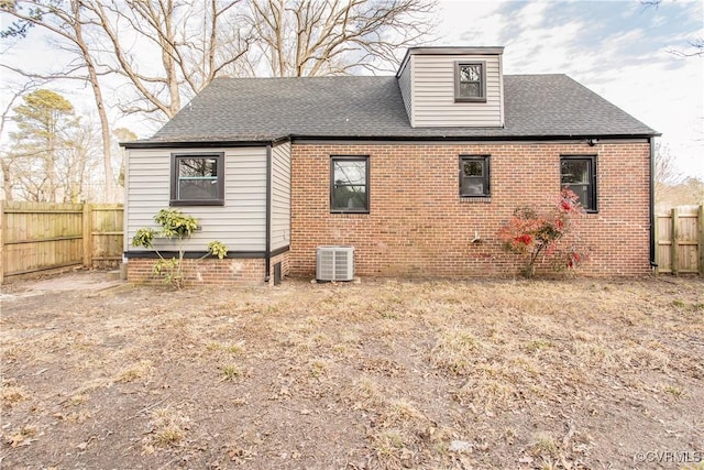 rear view of house with central AC