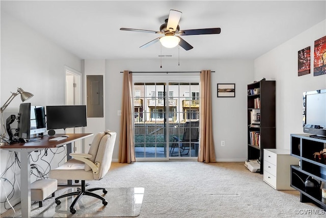 home office with light colored carpet, electric panel, and ceiling fan