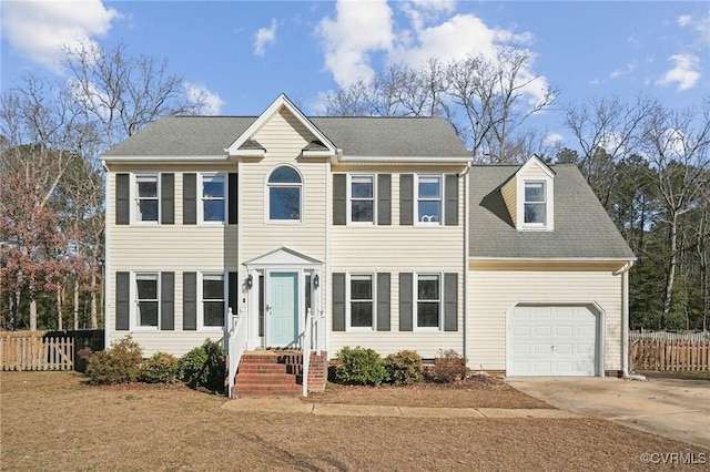 colonial home with a garage