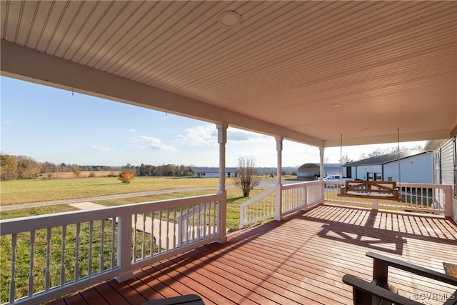 wooden deck with a rural view