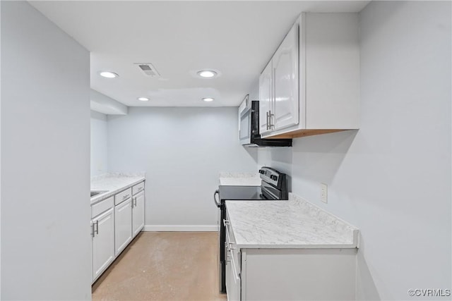 kitchen with white cabinetry, black electric range oven, and light hardwood / wood-style flooring