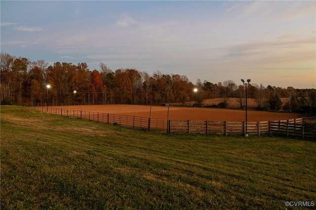 yard at dusk with a rural view