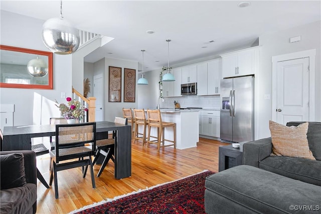 interior space featuring sink and light wood-type flooring