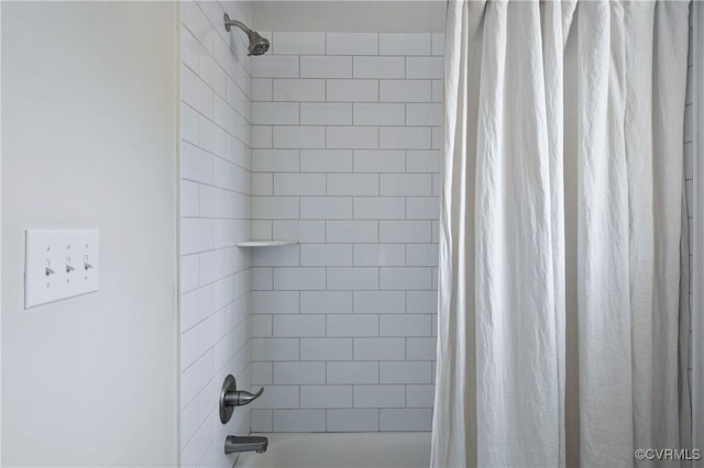 bathroom with shower / bathtub combination with curtain