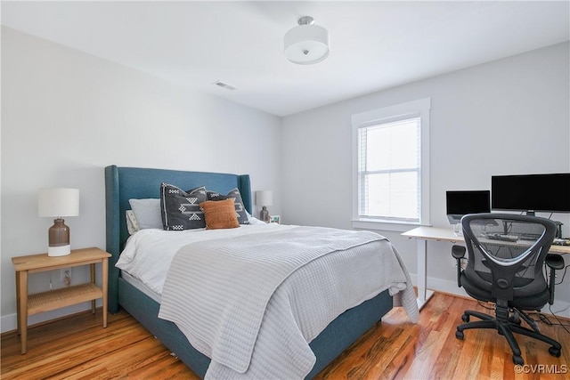 bedroom featuring hardwood / wood-style flooring