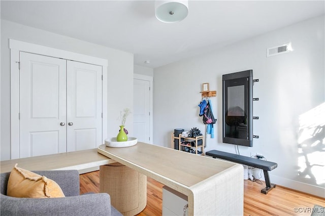 home office with hardwood / wood-style floors