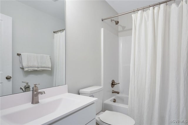 full bathroom featuring vanity, shower / tub combo, and toilet