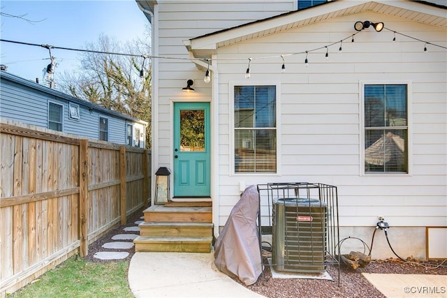 entrance to property featuring cooling unit