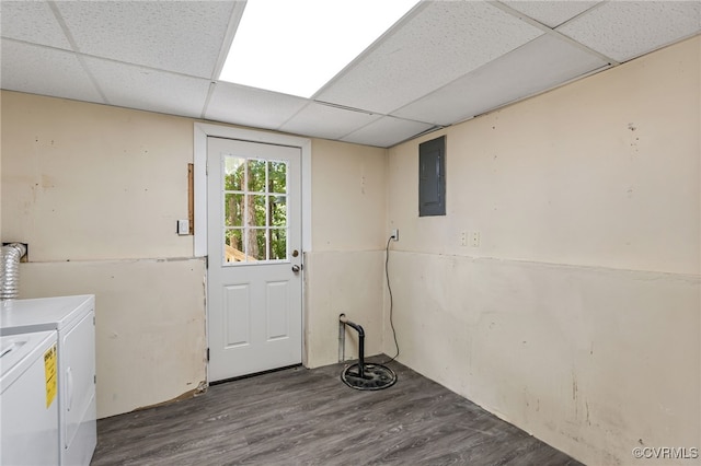 washroom with washing machine and dryer, hardwood / wood-style floors, and electric panel