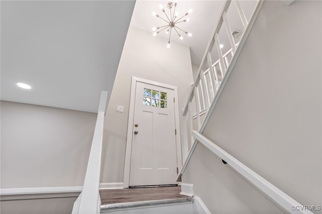 foyer entrance featuring an inviting chandelier