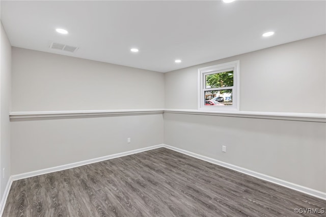 unfurnished room featuring dark hardwood / wood-style floors