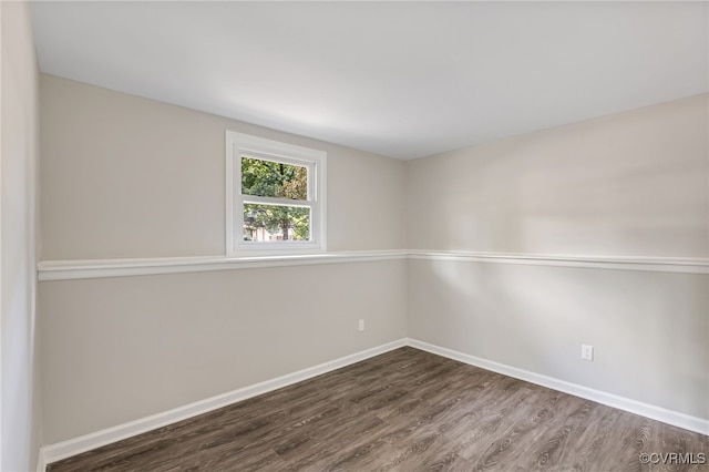 empty room featuring dark hardwood / wood-style flooring