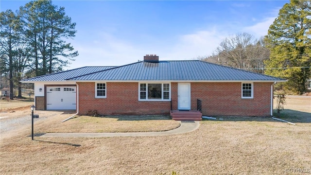 ranch-style house with a garage and a front yard