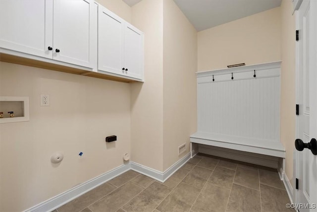 laundry area with washer hookup, hookup for an electric dryer, cabinets, and gas dryer hookup