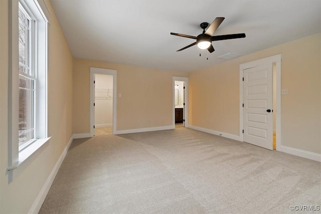 carpeted empty room with ceiling fan