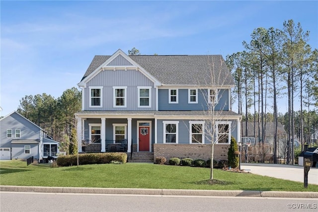 view of front of home featuring a porch and a front lawn