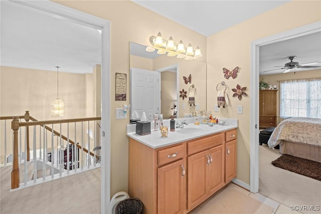 bathroom with ceiling fan and vanity