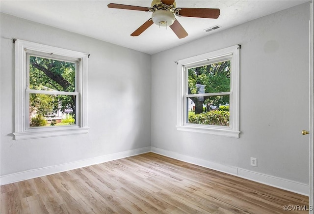 unfurnished room featuring ceiling fan and light wood-type flooring