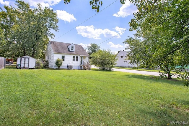 view of yard with central AC and a storage unit