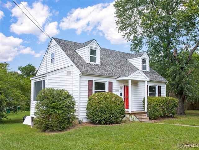 cape cod house with a front lawn