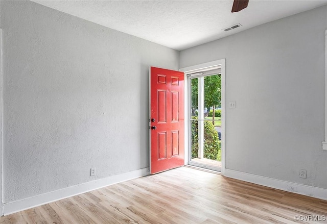 entryway with ceiling fan and light wood-type flooring