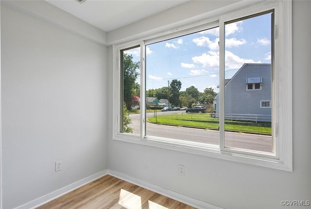 unfurnished room featuring light wood-type flooring