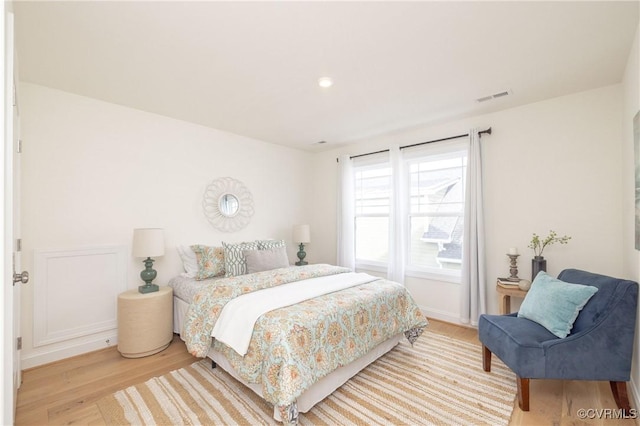 bedroom with light hardwood / wood-style floors