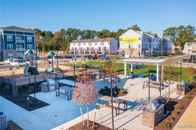 exterior space with area for grilling, a pergola, and a playground