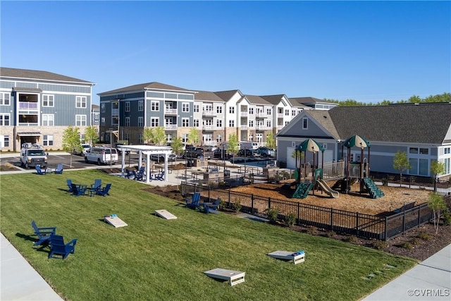 view of play area with a yard and a pergola