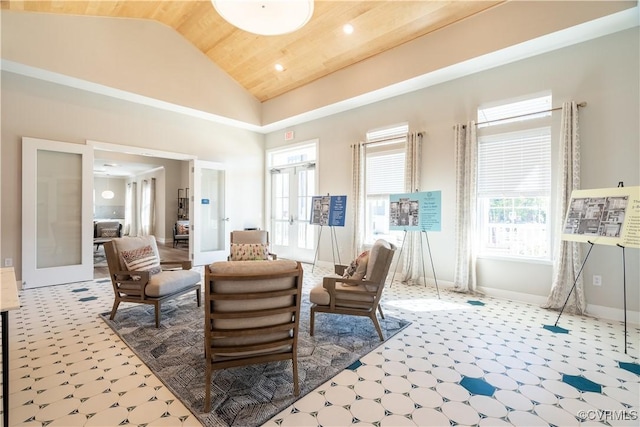 sitting room featuring wooden ceiling, high vaulted ceiling, and french doors