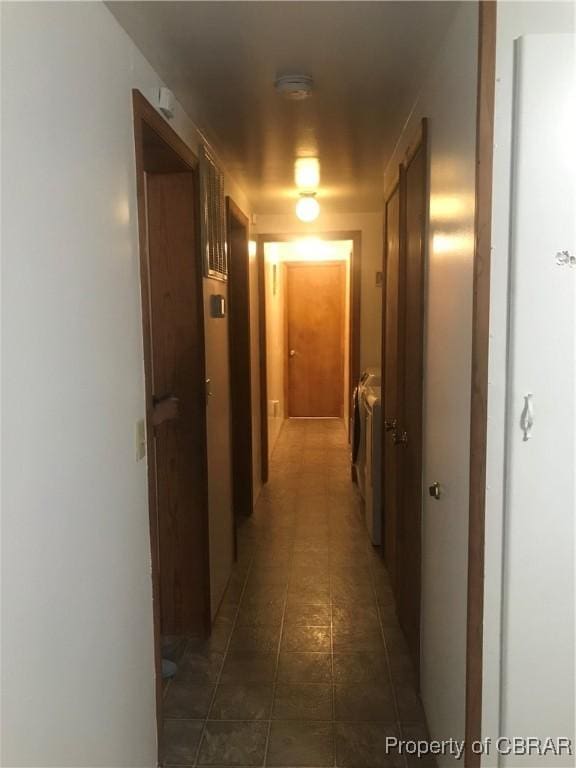 corridor with independent washer and dryer