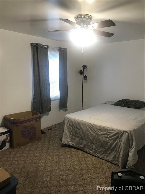 bedroom with ceiling fan and carpet flooring