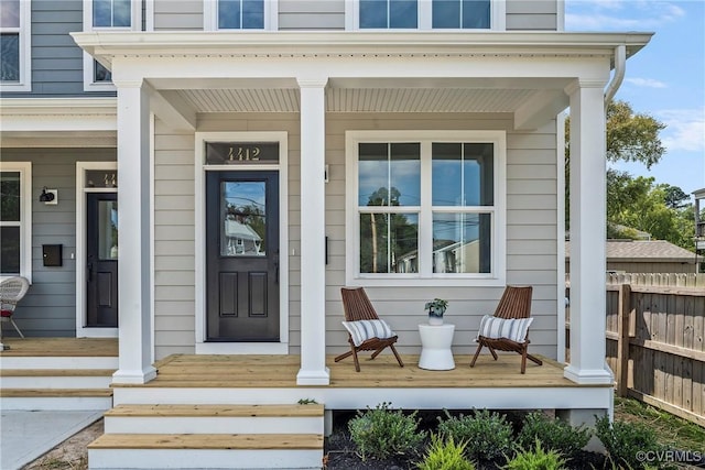 property entrance featuring a porch