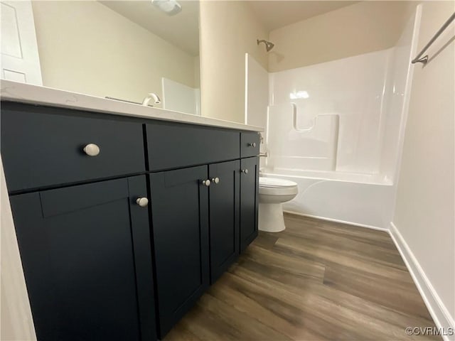 1841 Walkerton Rd, Chesterfield, VA 23236 - full bathroom with toilet, vanity, tub / shower combination, wood finished floors, and baseboards