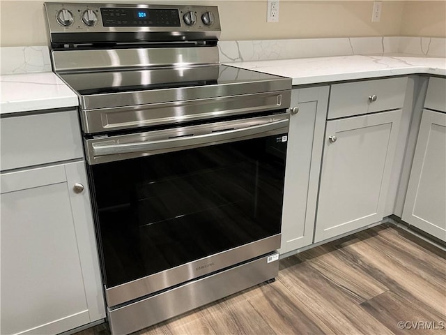 1841 Walkerton Rd, Chesterfield, VA 23236 - kitchen with electric range, dark wood-type flooring, light stone counters, and gray cabinets