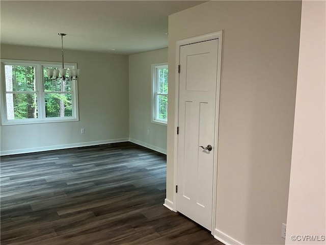 1841 Walkerton Rd, Chesterfield, VA 23236 - spare room featuring a chandelier, dark wood-style flooring, and baseboards