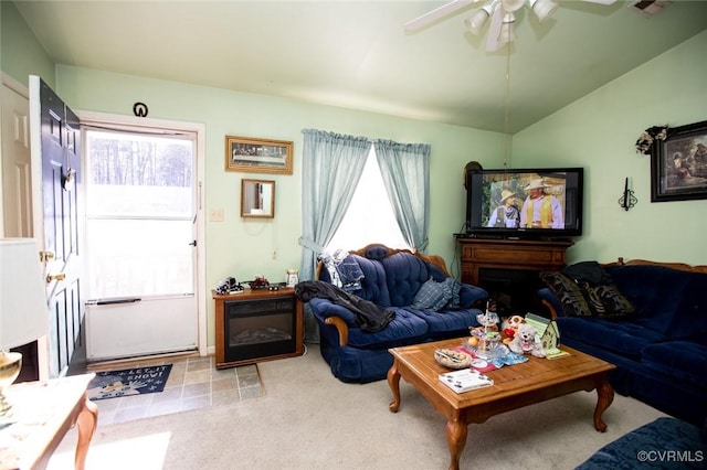 carpeted living room featuring lofted ceiling and ceiling fan