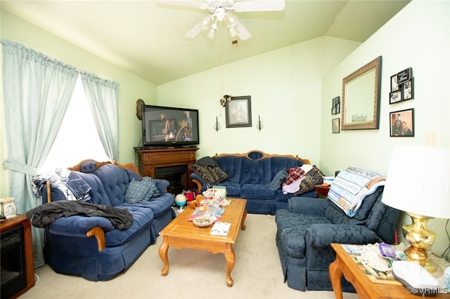 living room with ceiling fan, light colored carpet, and lofted ceiling