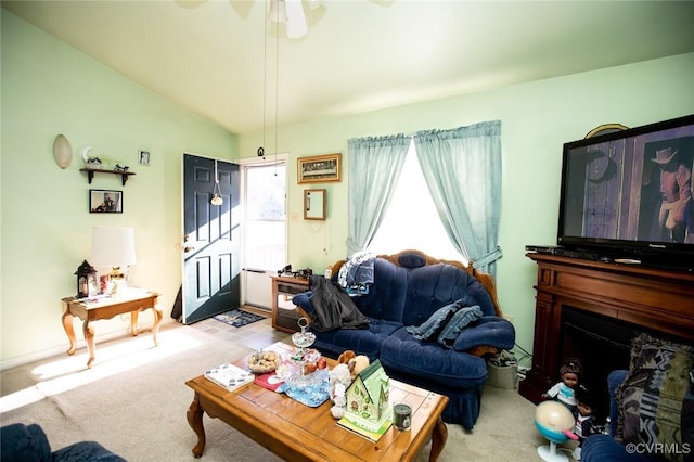 living room with light carpet and vaulted ceiling