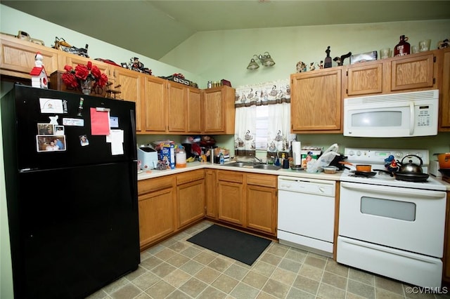 kitchen featuring sink, white appliances, and vaulted ceiling