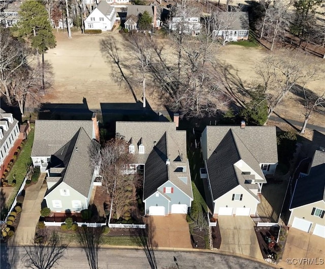 birds eye view of property with a residential view