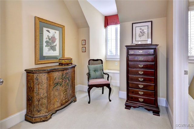 sitting room with lofted ceiling, carpet flooring, and baseboards