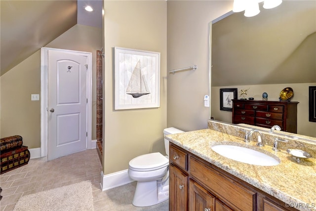 full bath with toilet, baseboards, lofted ceiling, and vanity