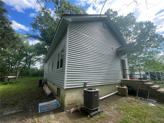 view of side of home featuring central air condition unit