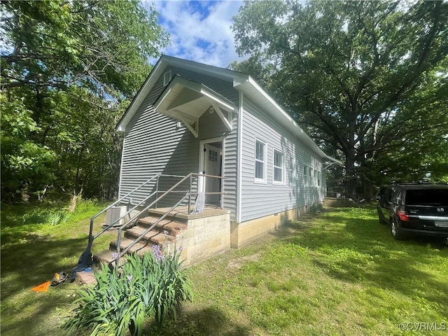 view of home's exterior with a lawn