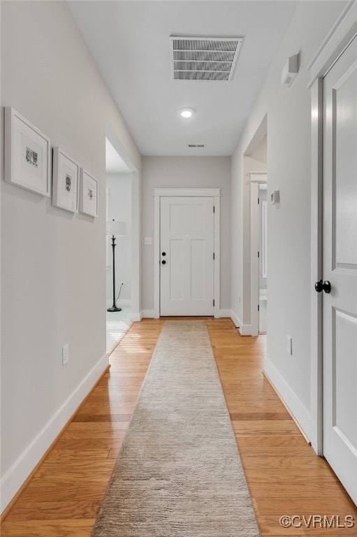 corridor featuring light hardwood / wood-style flooring